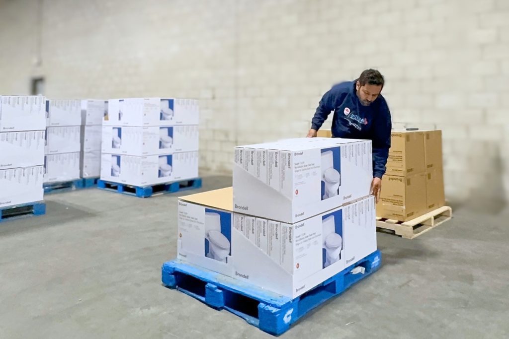 Forklift operator staging compliant LTL freight in an InterFulfillment distribution centre for major big-box retailers.