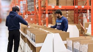 Point-of-Purchase display assembly and product kitting inside a Canadian fulfillment center